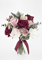 Artificial wedding bridesmaid bouquet, angled view of burgundy, blush and white faux roses, bronze flower clusters and burgundy ribbon bow. Made in Melbourne by Flowers For Ever After, shipping Australia and Worldwide.