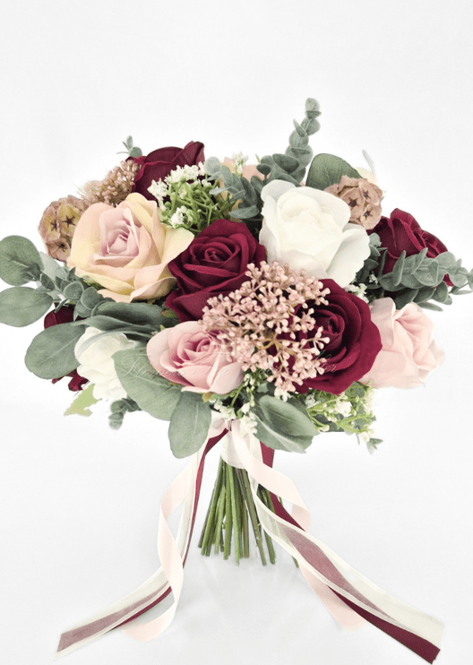 Artificial wedding bridal bouquet with burgundy, blush and white faux roses, tan seedpods, bronze clusters, eucalyptus and trailing ribbons. Made in Melbourne by Flowers For Ever After, shipping Australia and Worldwide.