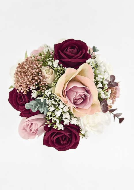 Artificial wedding small bouquet, overhead view of burgundy and blush faux roses, white blooms, tiny white flowers and bronze clusters. Made in Melbourne by Flowers For Ever After, shipping Australia and Worldwide.