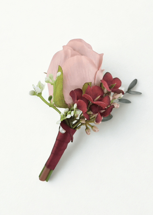 Artificial wedding boutonniere with a blush faux rosebud, burgundy blossoms, tiny white flowers and burgundy-wrapped stem. For formals, proms and ball occasions. Made in Melbourne by Flowers For Ever After, shipping Australia and Worldwide.