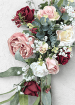 Artificial wedding arbor flower detail showing blush and burgundy faux roses, cream blooms, tiny white flowers and eucalyptus. Made in Melbourne by Flowers For Ever After, shipping Australia and Worldwide.