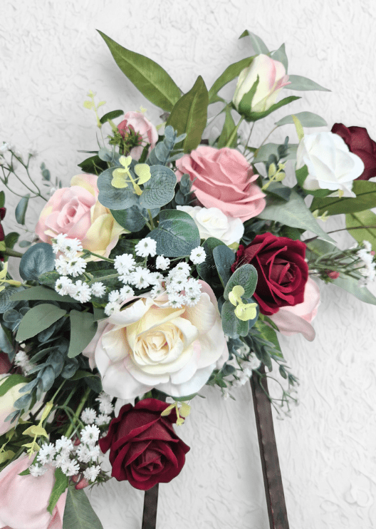 Artificial wedding arbor flower detail with burgundy, blush and cream faux roses, tiny white flowers and eucalyptus. Made in Melbourne by Flowers For Ever After, shipping Australia and Worldwide.