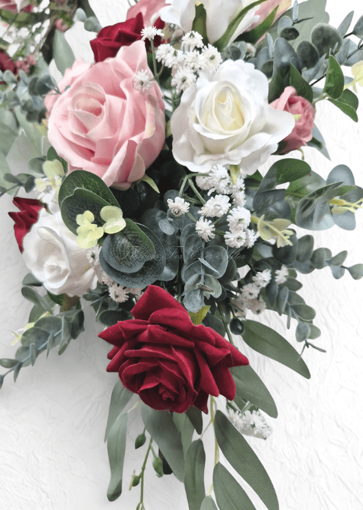 Artificial wedding arbor flower detail with blush, white and burgundy faux roses, tiny white flowers and eucalyptus. Made in Melbourne by Flowers For Ever After, shipping Australia and Worldwide.