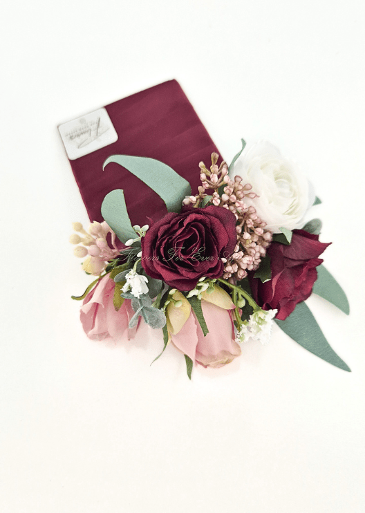Artificial wedding pocket corsage, overhead view of burgundy, blush and white faux roses, bronze clusters and green leaves. For formals, proms and ball occasions. Made in Melbourne by Flowers For Ever After, shipping Australia and Worldwide.