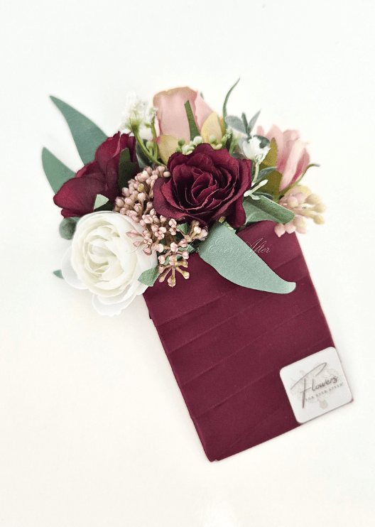 Artificial wedding pocket corsage with burgundy, blush and white faux roses, bronze clusters and green leaves on a burgundy fabric backing. For formals, proms and ball occasions. Made in Melbourne by Flowers For Ever After, shipping Australia and Worldwide.