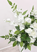 Artificial wedding ceremony flower detail showing tall white faux flower spikes, roses and pointed green leaves. Made in Melbourne by Flowers For Ever After, shipping Australia and Worldwide.