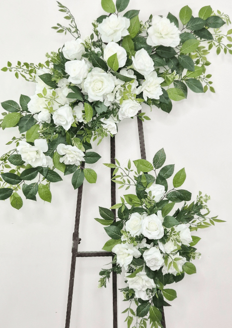 Artificial wedding ceremony floral set with an angled large white faux rose spray and smaller green-foliage tieback. Made in Melbourne by Flowers For Ever After, shipping Australia and Worldwide.