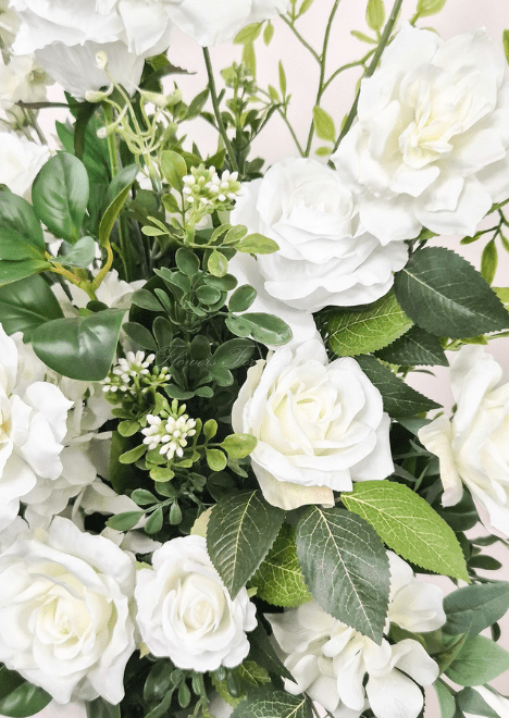 Artificial wedding pedestal flower close-up with white faux roses, open blooms, tiny buds and green leaves. Made in Melbourne by Flowers For Ever After, shipping Australia and Worldwide.