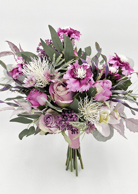 Artificial wedding bridesmaid bouquet with mauve faux roses, purple flowers, white spiky blooms, orchids and eucalyptus. Made in Melbourne by Flowers For Ever After, shipping Australia and Worldwide.