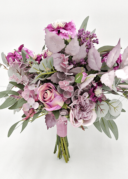 Artificial wedding bridesmaid bouquet, reverse view of mauve faux roses, pale orchids, purple blooms and eucalyptus. Made in Melbourne by Flowers For Ever After, shipping Australia and Worldwide.