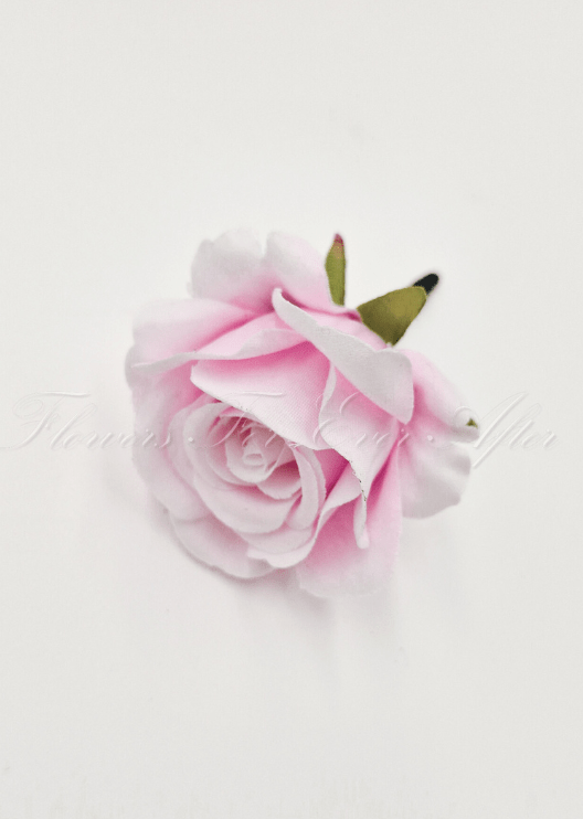 Artificial wedding boutonniere, top view of a pale pink faux rose and green sepals. For formals, proms and ball occasions. Made in Melbourne by Flowers For Ever After, shipping Australia and Worldwide.