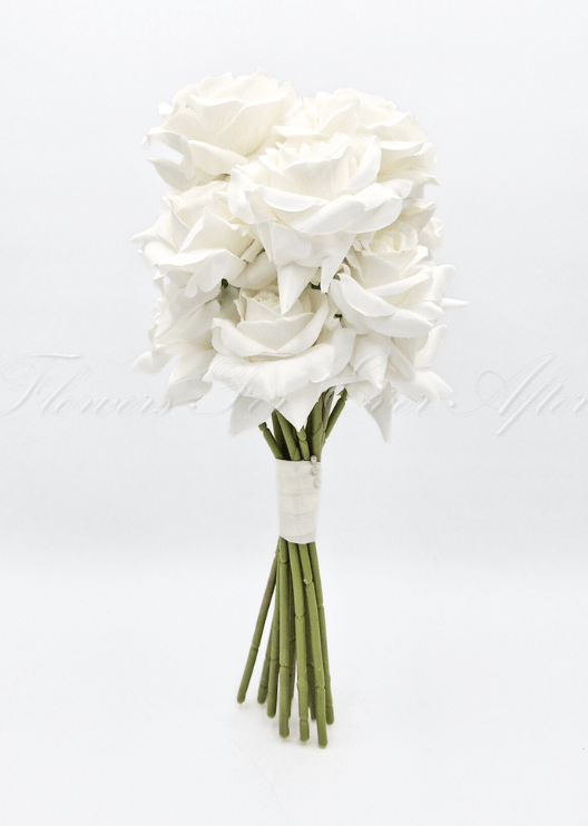Artificial wedding rose posy, angled view of white faux roses with an ivory-wrapped handle and green stems. Made in Melbourne by Flowers For Ever After, shipping Australia and Worldwide.