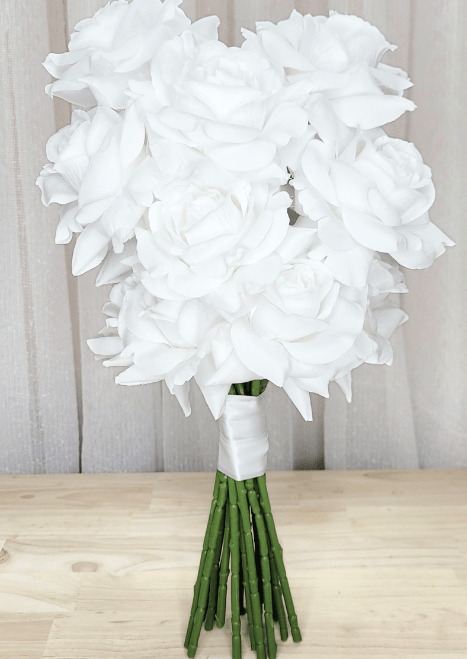 Artificial wedding hand-tied bridal bouquet with white faux roses and white ribbon-wrapped green stems. Made in Melbourne by Flowers For Ever After, shipping Australia and Worldwide.