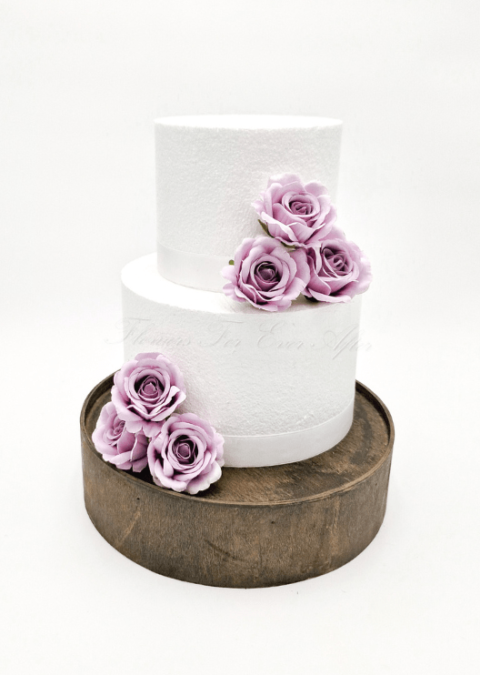 Artificial wedding cake decoration with faux roses, small flowers and green leaves arranged across the tiers. For birthday, event and celebration cakes. Made in Melbourne by Flowers For Ever After, shipping Australia and Worldwide.