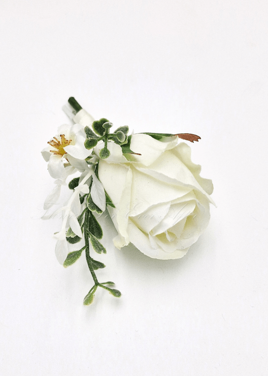 Artificial wedding cake decoration close-up showing faux rose petals, small flowers and greenery. For birthday, event and celebration cakes. Made in Melbourne by Flowers For Ever After, shipping Australia and Worldwide.