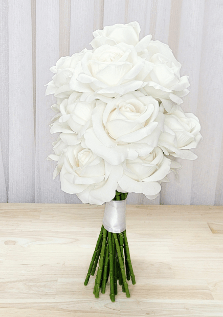 Artificial wedding bridal bouquet with white-ivory faux roses, white ribbon wrapping and gathered green stems. Made in Melbourne by Flowers For Ever After, shipping Australia and Worldwide.