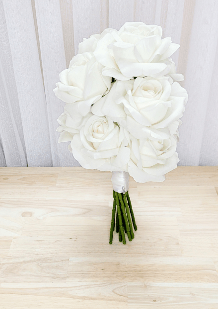 Artificial wedding bridesmaid bouquet, angled view of clustered white-ivory faux roses and gathered stems. Made in Melbourne by Flowers For Ever After, shipping Australia and Worldwide.