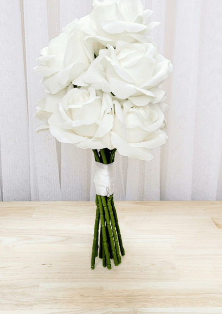 Artificial wedding bridesmaid bouquet with white-ivory faux roses and white-wrapped green stems. Made in Melbourne by Flowers For Ever After, shipping Australia and Worldwide.