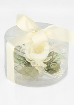 Artificial wedding corsage gift presentation with ivory faux blooms and fine sprigs in a clear rounded box tied with ivory ribbon. For formals, proms and ball occasions. Made in Melbourne by Flowers For Ever After, shipping Australia and Worldwide.