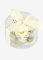 Artificial wedding corsage with ivory faux blooms and fine sprigs in a clear rounded gift box tied with an ivory ribbon bow. For formals, proms and ball occasions. Made in Melbourne by Flowers For Ever After, shipping Australia and Worldwide.