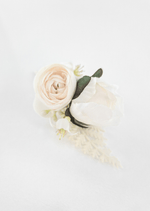 Artificial wedding boutonniere, overhead view of a cream faux peony bud, small ivory bloom, tiny white flowers and green leaves. For formals, proms and ball occasions. Made in Melbourne by Flowers For Ever After, shipping Australia and Worldwide.