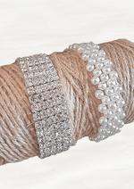 Artificial wedding corsage bracelet-base options for faux flowers, showing a silver rhinestone band and white pearl-style beads. For formals, proms and ball occasions. Made in Melbourne by Flowers For Ever After, shipping Australia and Worldwide.