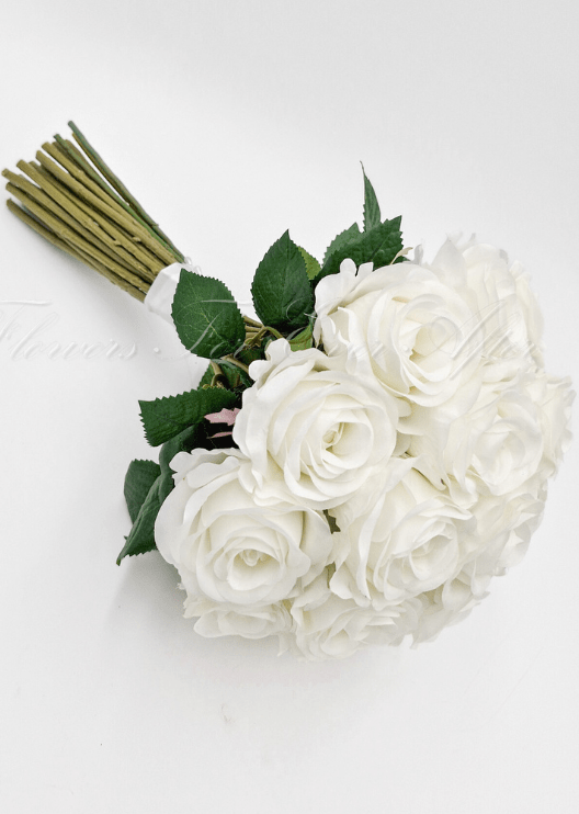 Artificial wedding bridesmaid posy, angled view of mixed faux flowers and green leaves. Made in Melbourne by Flowers For Ever After, shipping Australia and Worldwide.