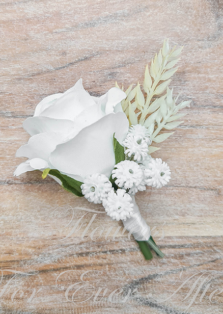 Artificial wedding boutonniere with a white faux rose, small white daisy-like flowers and pale foliage, with wrapped stems. For formals, proms and ball occasions. Made in Melbourne by Flowers For Ever After, shipping Australia and Worldwide.
