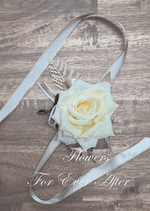 Artificial wedding wrist corsage with a deep cream faux rose, small pale blooms, green leaves and ivory ribbon ties. For formals, proms and ball occasions. Made in Melbourne by Flowers For Ever After, shipping Australia and Worldwide.