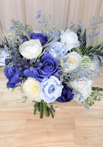 Artificial wedding bouquet, overhead view of navy, pale blue and white faux roses, white ranunculus and fine blue sprigs. Made in Melbourne by Flowers For Ever After, shipping Australia and Worldwide.