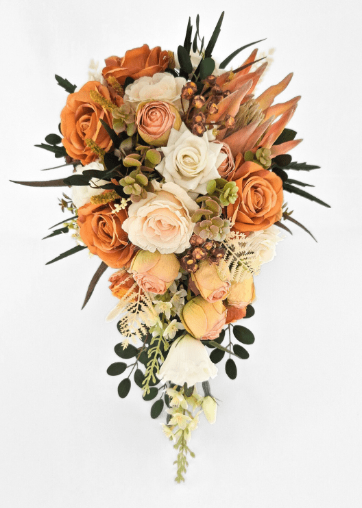 Artificial wedding cascading bridal bouquet with orange, peach and ivory faux roses, peach protea, olive-green hydrangea and trailing foliage. Made in Melbourne by Flowers For Ever After, shipping Australia and Worldwide.