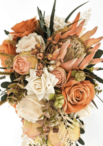 Artificial wedding bouquet detail showing peach faux protea, orange and ivory roses, bronze berry clusters and olive-green hydrangea. Made in Melbourne by Flowers For Ever After, shipping Australia and Worldwide.