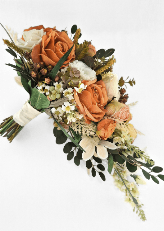 Artificial wedding bridal bouquet, reverse side view of orange and ivory faux roses, peach rosebuds and trailing eucalyptus. Made in Melbourne by Flowers For Ever After, shipping Australia and Worldwide.