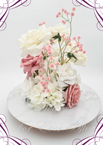 Artificial wedding centrepiece, side view of dusty pink faux roses, white roses, cream blooms, hydrangea and pink baby's breath. Made in Melbourne by Flowers For Ever After, shipping Australia and Worldwide.