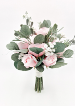 Artificial wedding bridesmaid bouquet, front view of pale pink faux roses, small white flowers and eucalyptus with ribbon-wrapped stems. Made in Melbourne by Flowers For Ever After, shipping Australia and Worldwide.