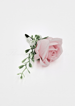 Artificial wedding boutonniere, top view of a pale pink faux rose with small white flowers and green sprigs. For formals, proms and ball occasions. Made in Melbourne by Flowers For Ever After, shipping Australia and Worldwide.