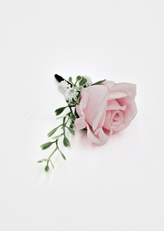 Artificial wedding boutonniere, top view of a pale pink faux rose with small white flowers and green sprigs. For formals, proms and ball occasions. Made in Melbourne by Flowers For Ever After, shipping Australia and Worldwide.