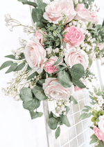 Artificial wedding ceremony arrangement, close-up of pale pink faux roses, white pompom flowers and eucalyptus. Made in Melbourne by Flowers For Ever After, shipping Australia and Worldwide.