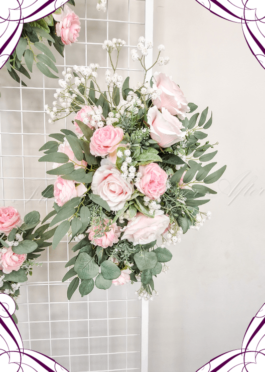 Artificial wedding ceremony arrangement with pale pink faux roses, white pompom flowers, eucalyptus and trailing green sprigs. Made in Melbourne by Flowers For Ever After, shipping Australia and Worldwide.