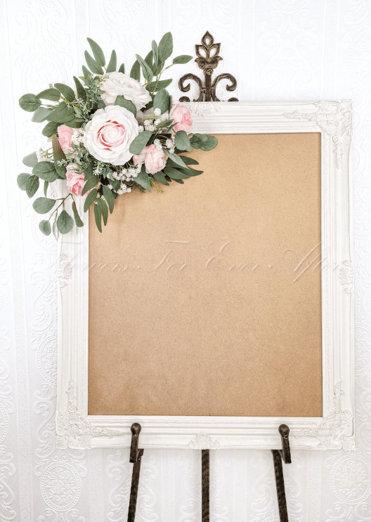 Artificial wedding sign floral display with pale pink faux roses, white flowers and eucalyptus surrounding a welcome sign. Made in Melbourne by Flowers For Ever After, shipping Australia and Worldwide.