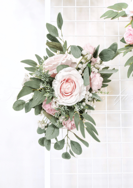Artificial wedding sign decoration with pale pink faux roses, white pompom flowers and eucalyptus at a sign corner. Made in Melbourne by Flowers For Ever After, shipping Australia and Worldwide.