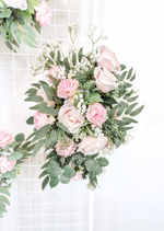 Artificial wedding floral tieback with pale pink faux roses, white pompom flowers, eucalyptus and trailing green sprigs. Made in Melbourne by Flowers For Ever After, shipping Australia and Worldwide.
