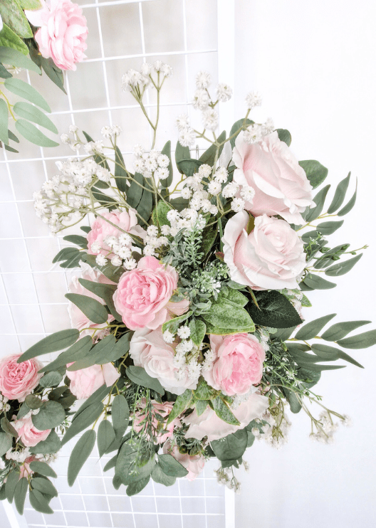 Artificial wedding floral tieback, front view of pale pink faux roses, white blooms and eucalyptus. Made in Melbourne by Flowers For Ever After, shipping Australia and Worldwide.