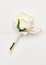 Artificial wedding boutonniere with a white faux orchid, pale flowers and green foliage, finished with wrapped stems. For formals, proms and ball occasions. Made in Melbourne by Flowers For Ever After, shipping Australia and Worldwide.