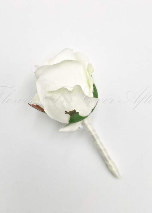 Artificial wedding boutonniere, side view of a white faux rosebud with green sepals and ivory ribbon-wrapped stem. For formals, proms and ball occasions. Made in Melbourne by Flowers For Ever After, shipping Australia and Worldwide.