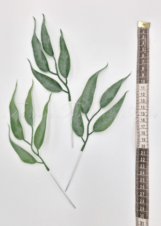 Artificial wedding foliage pieces with three faux eucalyptus sprigs and pointed grey-green leaves shown beside a measuring tape. Made in Melbourne by Flowers For Ever After, shipping Australia and Worldwide.