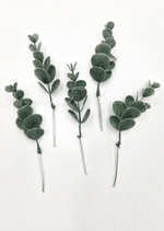 Artificial wedding foliage pieces with five faux eucalyptus sprigs, rounded dark green leaves and exposed mounting wires. Made in Melbourne by Flowers For Ever After, shipping Australia and Worldwide.