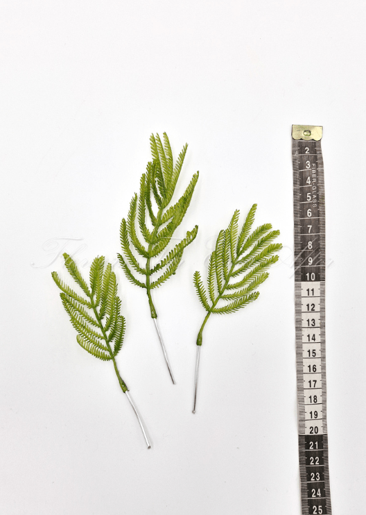 Artificial wedding foliage pieces with three faux fern-like sprigs and bright green leaflets shown beside a measuring tape. Made in Melbourne by Flowers For Ever After, shipping Australia and Worldwide.