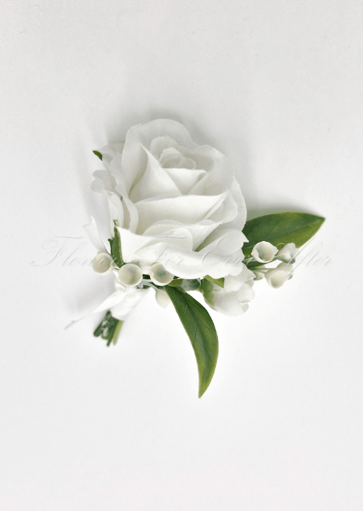 Artificial wedding boutonniere, top view of a white faux rose, white berry sprigs and green leaves. For formals, proms and ball occasions. Made in Melbourne by Flowers For Ever After, shipping Australia and Worldwide.