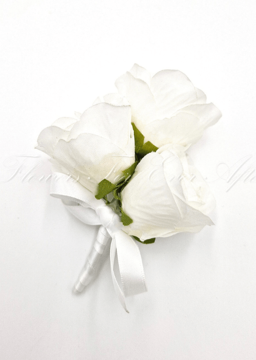 Artificial wedding pin corsage with three white faux roses, green sepals, a white ribbon bow and wrapped stems. For formals, proms and ball occasions. Made in Melbourne by Flowers For Ever After, shipping Australia and Worldwide.